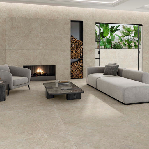 Premiere Natural cream beige stone effect porcelain tiles in a contemporary living room with subtle mottled detailing and a matt finish.